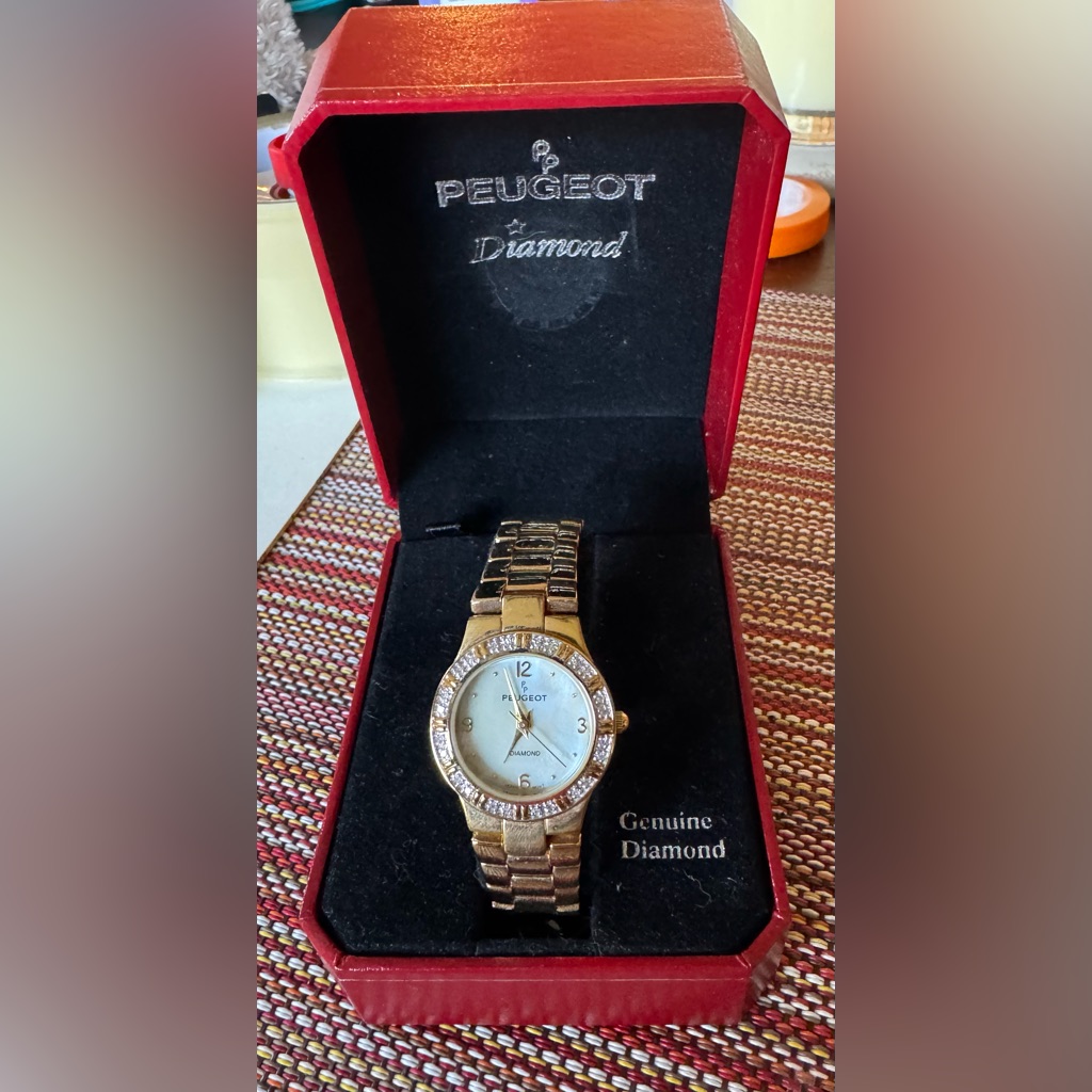 Peugeot Gold And Silver Timepiece With Sparkling Accents